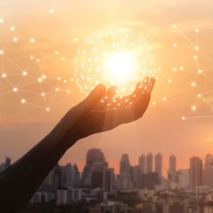 Human connection shown with a hand holding connections of light.
